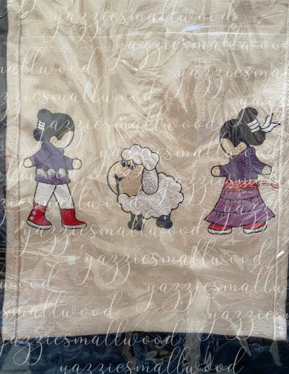 Navajo boy and girl in Traditional Attire with their sheep tote