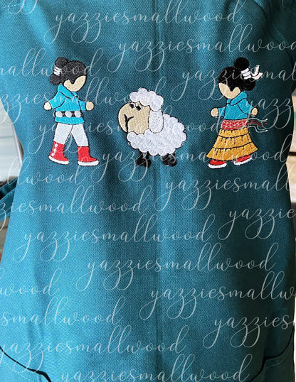 Navajo boy and girl in Traditional Attire with their sheep Apron